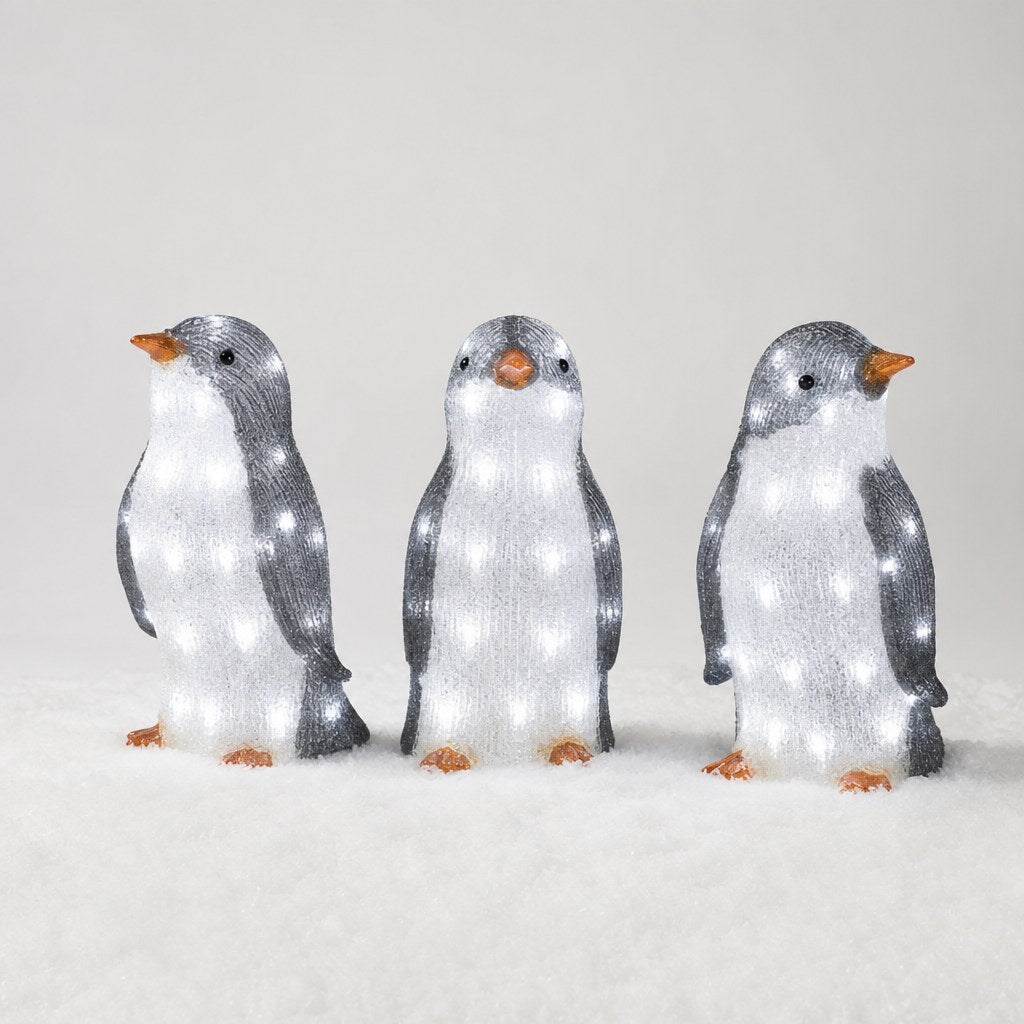 Set of 3 light-up acrylic penguins: left-facing, front-facing and right-facing
